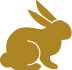 Gold icon in the shape of a rabbit.